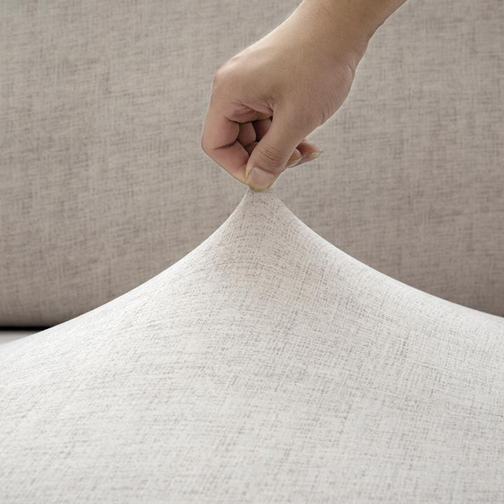 Cubre sofá elástico marfil, aporta estilo moderno y protección a la decoración de tu hogar y sala.