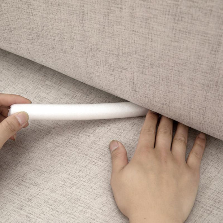 Funda protectora de sofá elástica marfil, ideal para renovar y proteger tus muebles del día a día.