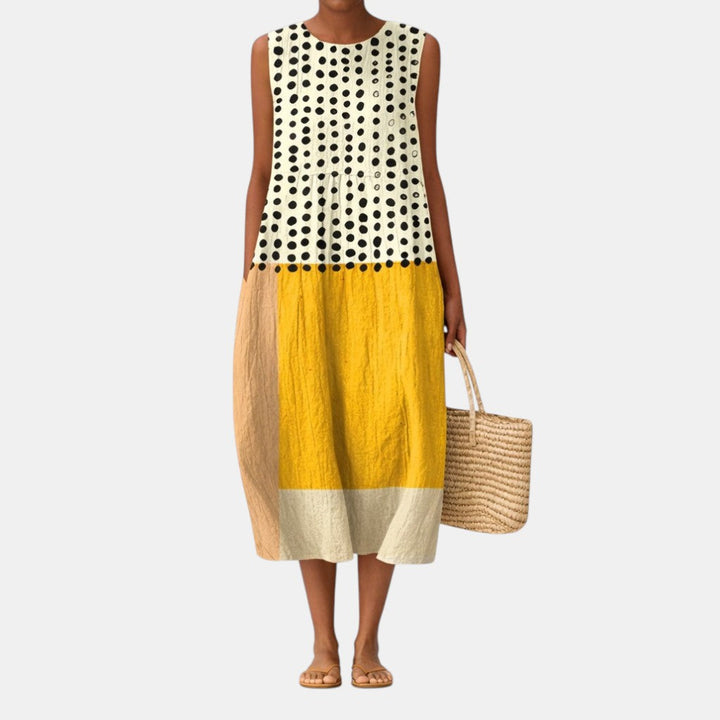 Vestido midi sin mangas de lunares para mujer, perfecto para un look casual de verano en algodón y viscosa.