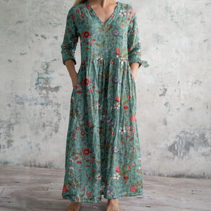 Vestido largo de noche para invitada, diseño elegante con escote V y mangas 3/4, perfecto para celebraciones.