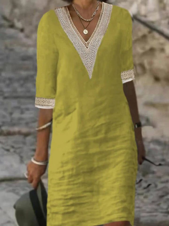 Moda femenina: Vestido elegante con encaje y escote en V, ideal para verano y ocasiones especiales.