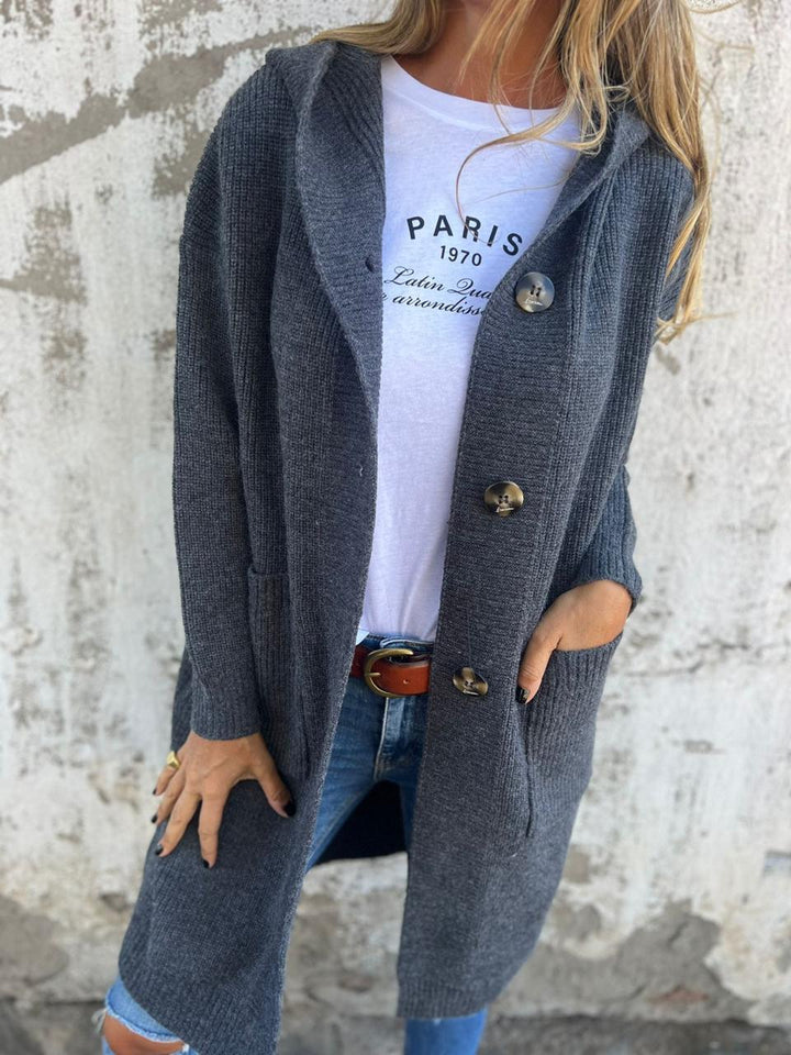 Cárdigan elegante de punto largo con capucha y bolsillos, versátil para moda casual de mujer en invierno.