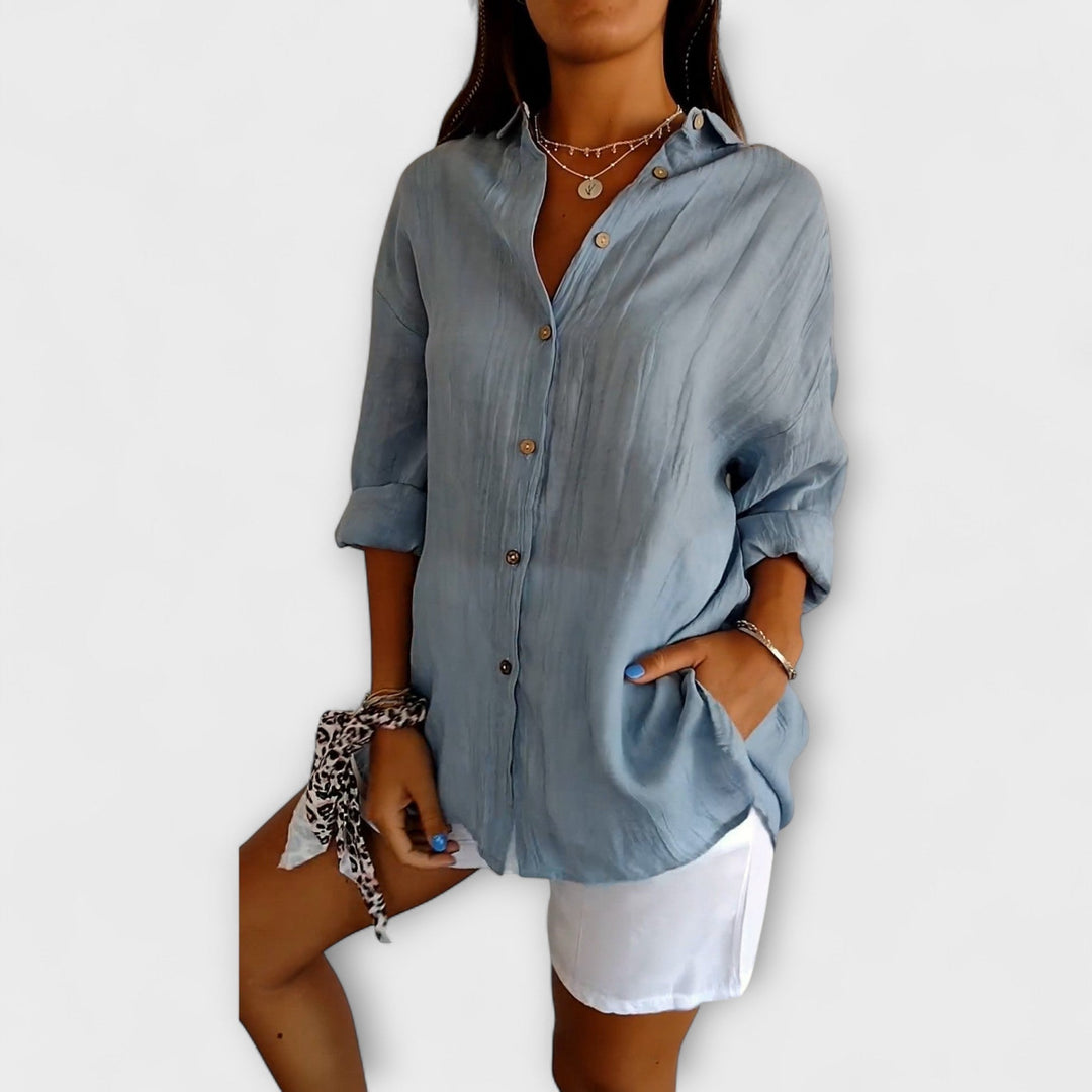 Blusa elegante y cómoda para mujer, con un diseño plisado versátil y moderno.