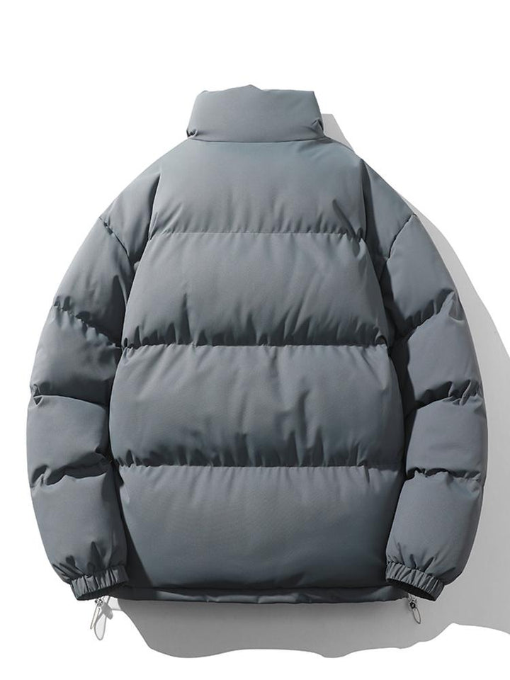 Cálida chaqueta acolchada de invierno para hombre, ideal para exterior.