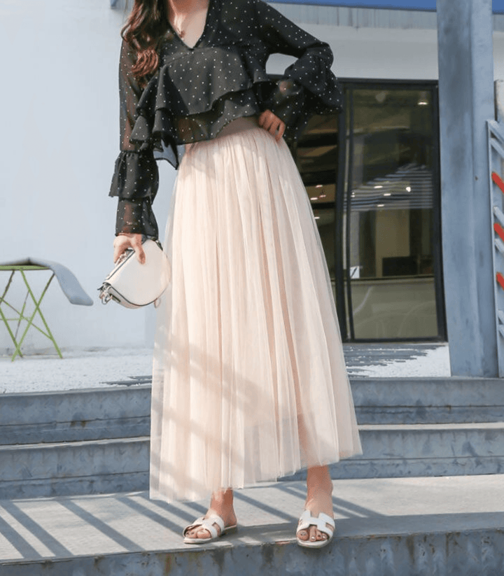 Elegante falda larga para mujer, con cintura alta y diseño estilizado, perfecta para un look sofisticado.