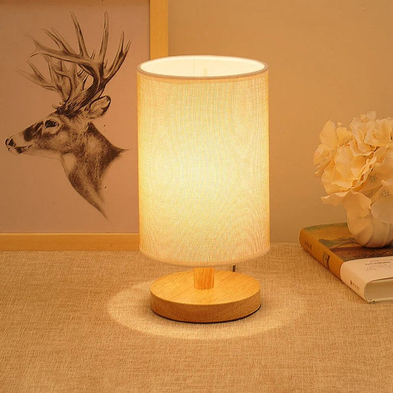 Lámpara de mesa cilíndrica LED táctil, base de madera. Ideal como lámpara de noche o decorativa.