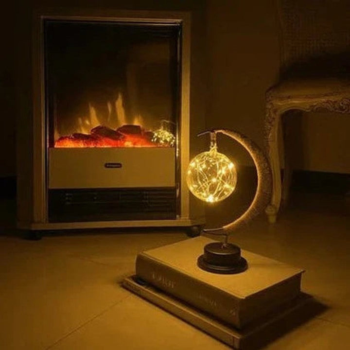 Lámpara de mesa LED con forma de luna creciente. Perfecta para decoración y luz ambiental acogedora en el hogar.