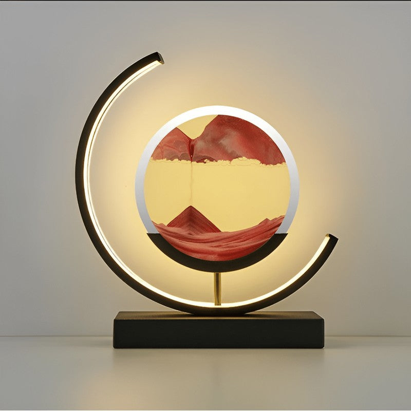 Lámpara de mesa con arena cinética y luz LED, creando ambiente relajante. Ideal para decoración moderna del hogar.