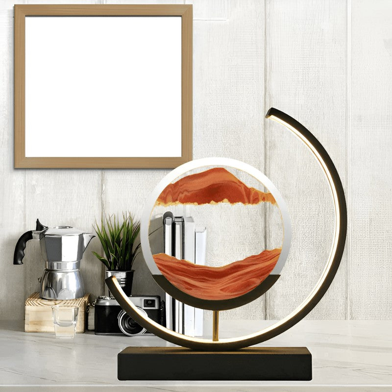 Iluminación decorativa para el hogar: lámpara de mesa con arena cinética y luz LED relajante para crear atmósfera.