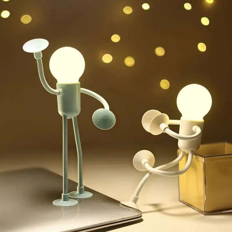 Lámpara LED flexible con diseño de figura humana, ideal para ajustar la luz en la mesa de noche.