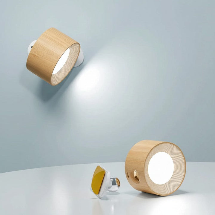Lámpara de pared giratoria para iluminación interior moderna, luz direccional y recargable.