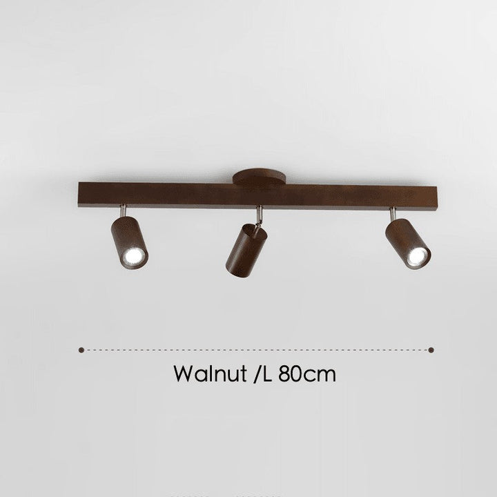 Lámpara de techo de madera clara, minimalista, con focos ajustables en negro.