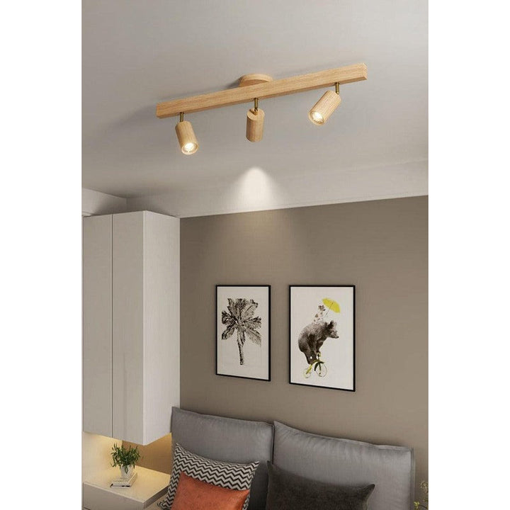 Lámpara de techo de madera, estilo minimalista. Detalle de focos LED en blanco.