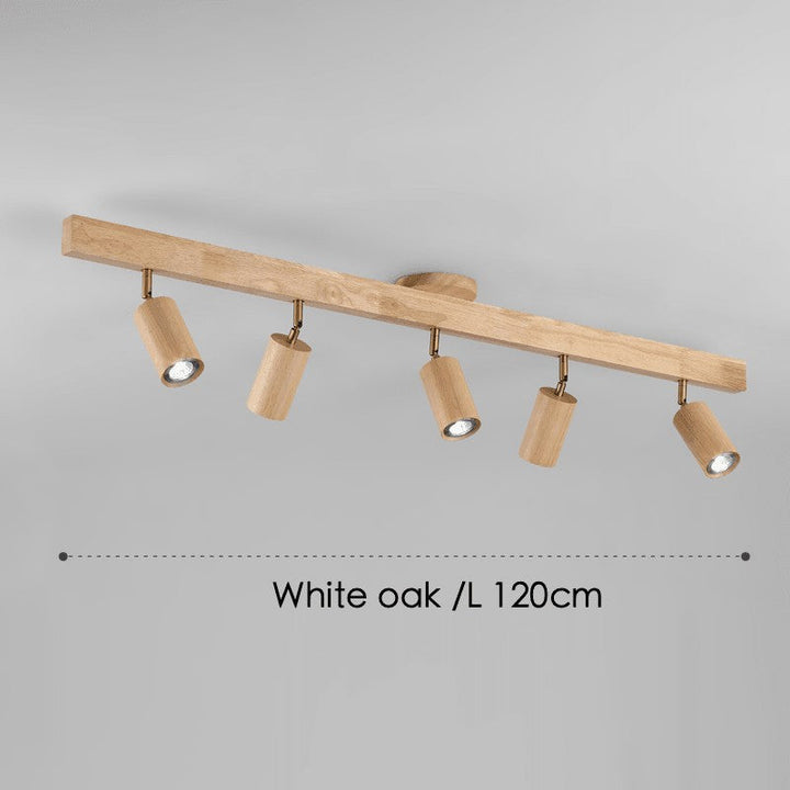 Primer plano de lámpara de techo minimalista de madera con focos LED para interior.