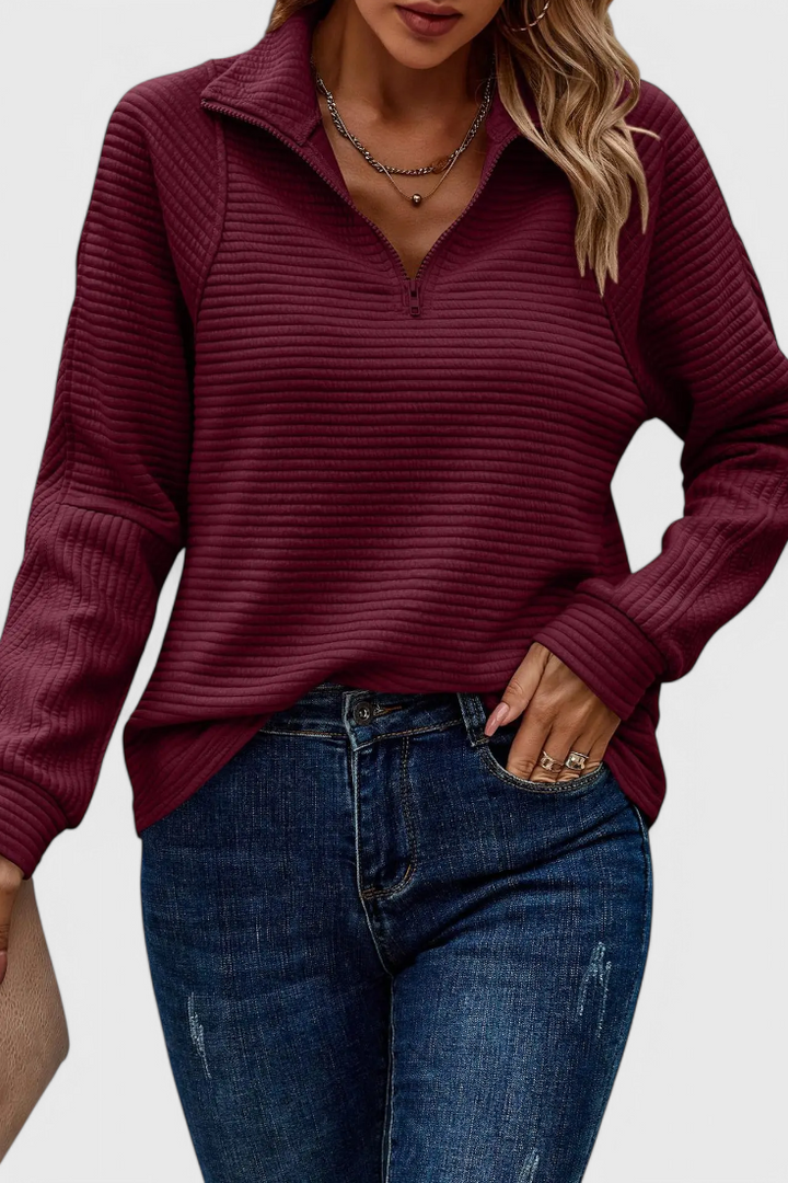 Prenda versátil: jersey de mujer elegante, escote en V, cremallera. Combina con estilo y comodidad.