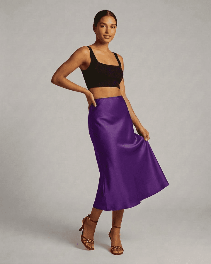 Elegante falda midi de sirena púrpura para mujer, perfecta para fiestas y ocasiones especiales.