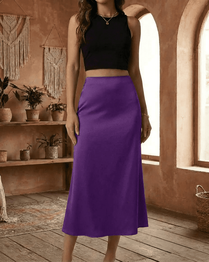 Falda púrpura vibrante con diseño de sirena, cintura alta, longitud midi para mujer moderna.