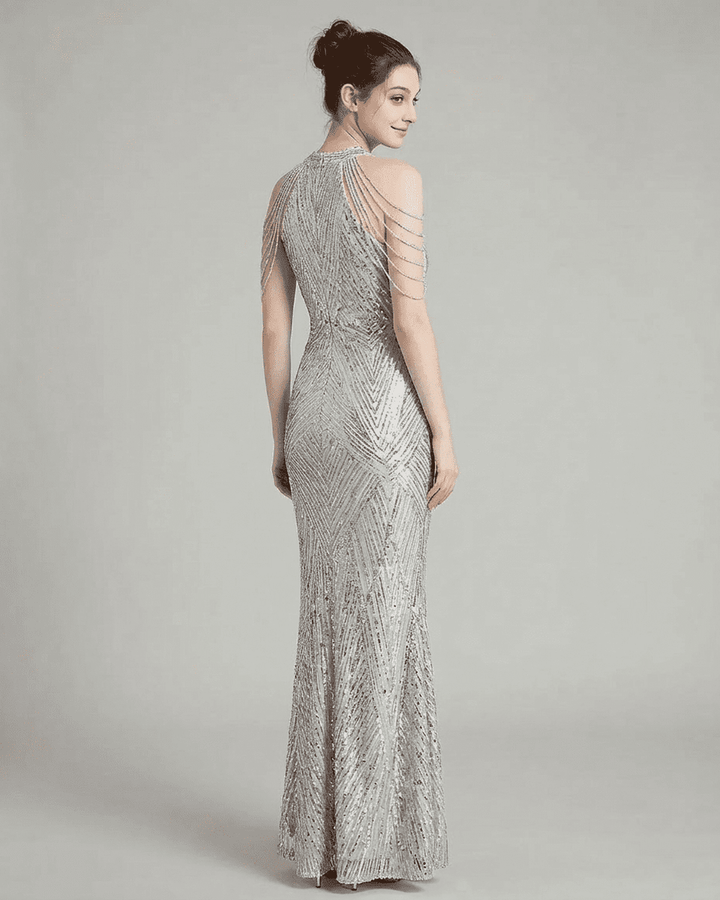 Elegante vestido de fiesta maxi con lentejuelas brillantes, corte sirena y escote halter para mujer.