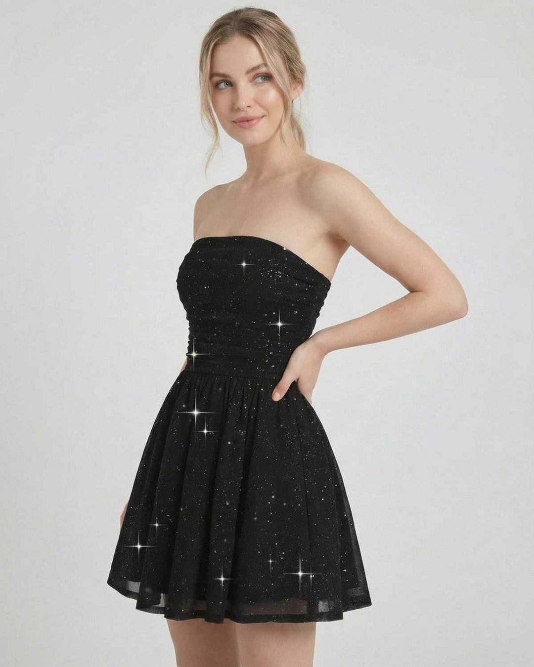 Elegante vestido mini de mujer con lazo en la espalda, sin tirantes, para fiestas y eventos formales.