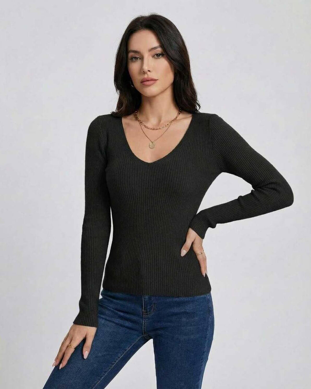 Suéter de mujer con cuello V, ajuste slim y manga larga. Pullover elegante y casual para otoño-invierno.