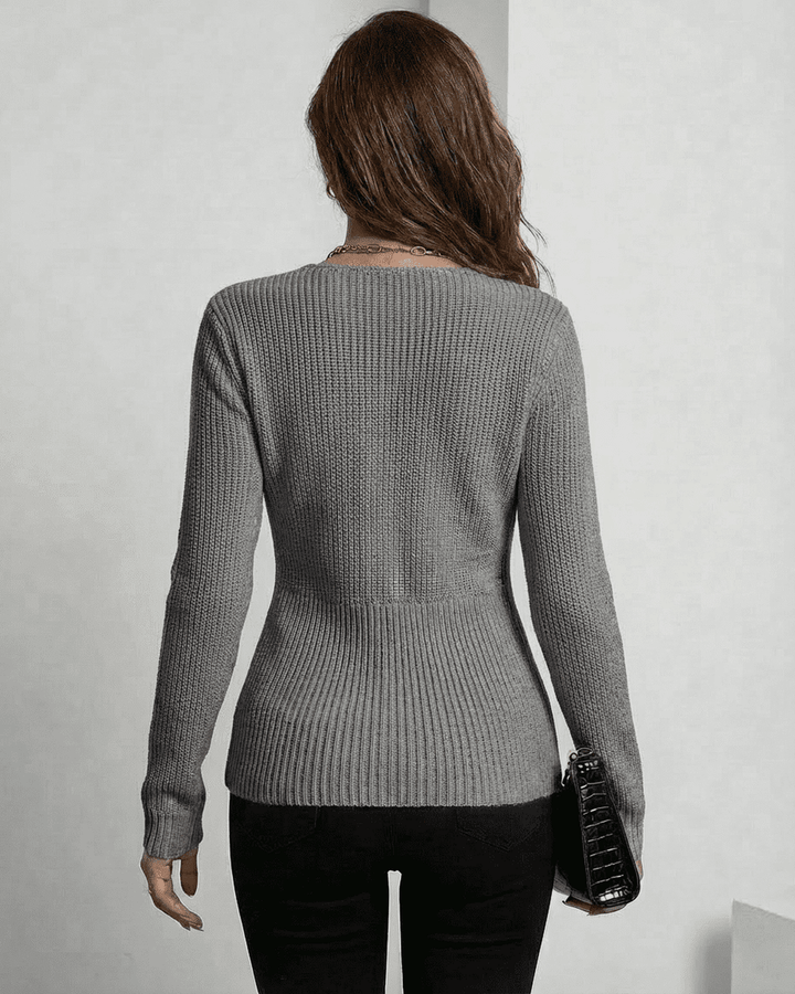 Pullover Nerina mujer gris. Cuello en V y ajuste estilizado, perfecto para moda femenina casual o elegante.