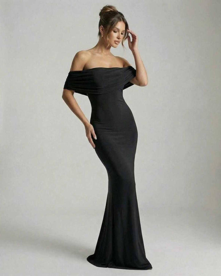 Vestido de noche negro maxi sin espalda para mujer. Diseño elegante off-shoulder, ideal para fiestas y celebraciones.