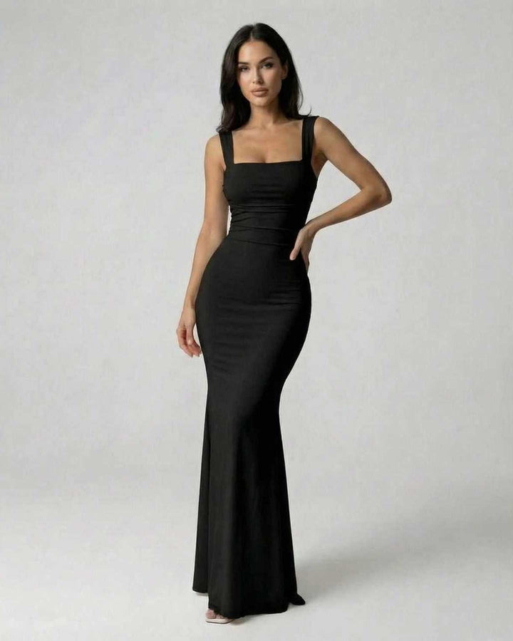 Vestido maxi negro sofisticado para mujer, ideal para cualquier ocasión especial, con elegante espalda cruzada.