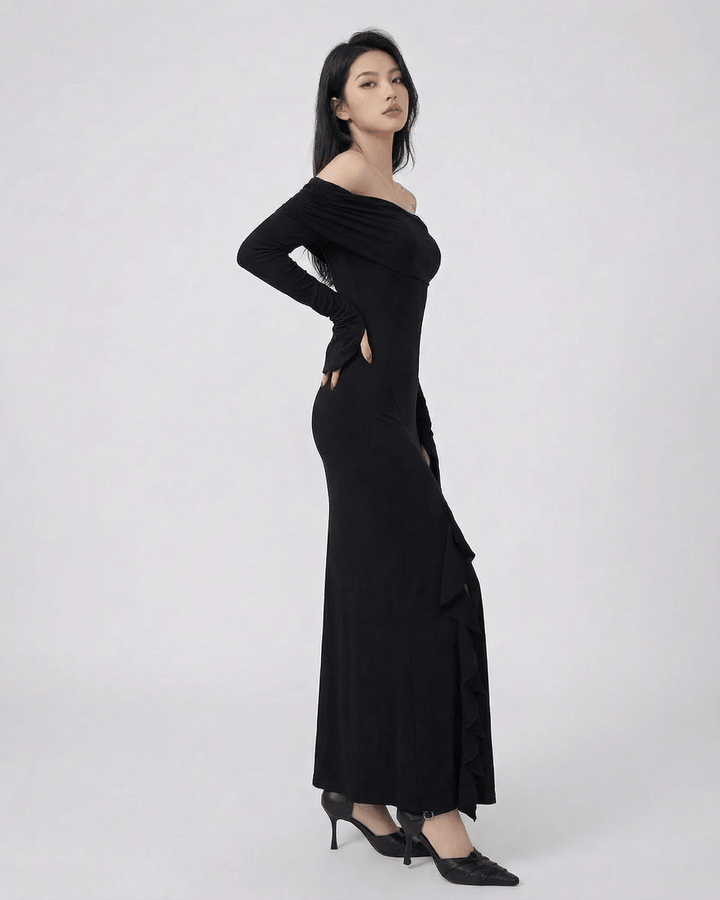 Vestido de noche negro asimétrico con diseño fluido, perfecto para eventos formales y elegantes.