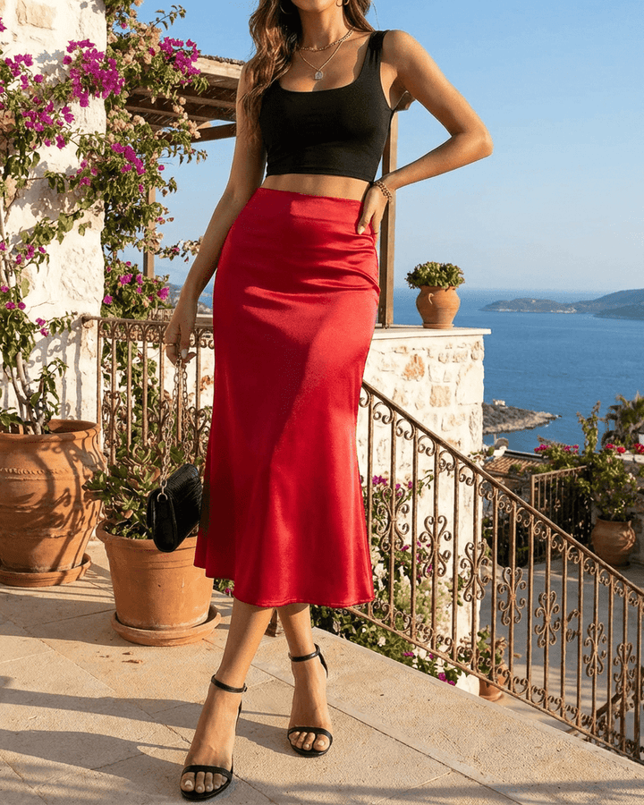 Falda midi roja vibrante, estilo sirena para mujer. Tendencia primavera/verano, ideal para fiesta y noche con elegancia.
