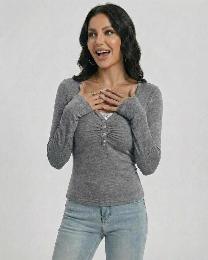 Pullover ajustado blanco para mujer, con cuello en V. Prenda de moda de otoño/invierno femenina.