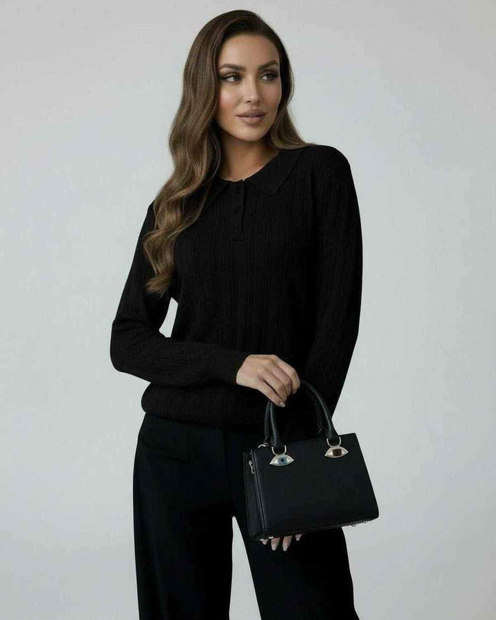 Suéter negro holgado para mujer, esencial de invierno, estilo casual y atemporal para días fríos.