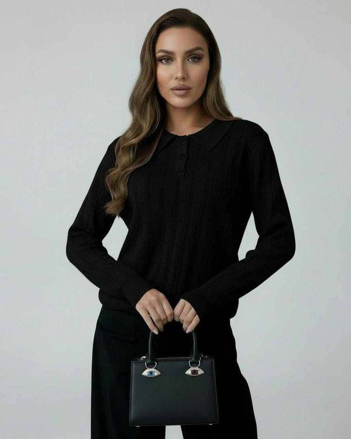 Suéter negro holgado para mujer, estilo atemporal, ideal para confort diario en invierno y otoño.