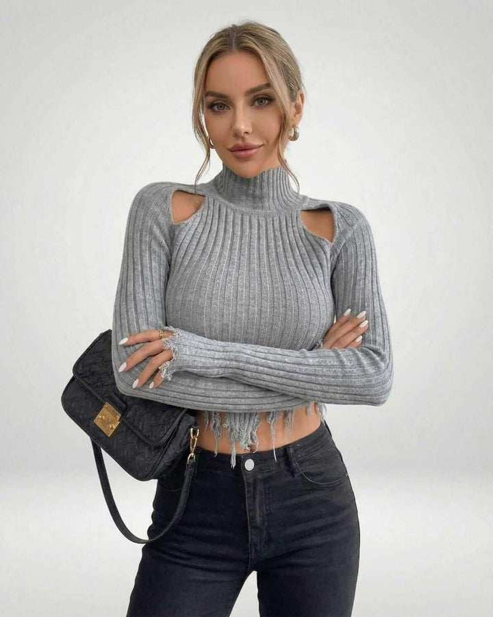 Suéter de mujer con escote asimétrico y tejido acanalado, clave en moda de invierno y estilo moderno.