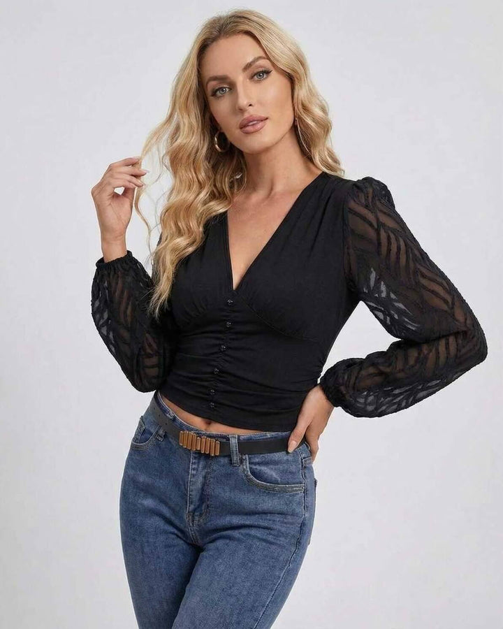 Pullover negro sofisticado de mujer, escote V y mangas farol. Perfecto para fiesta o noche de invierno.