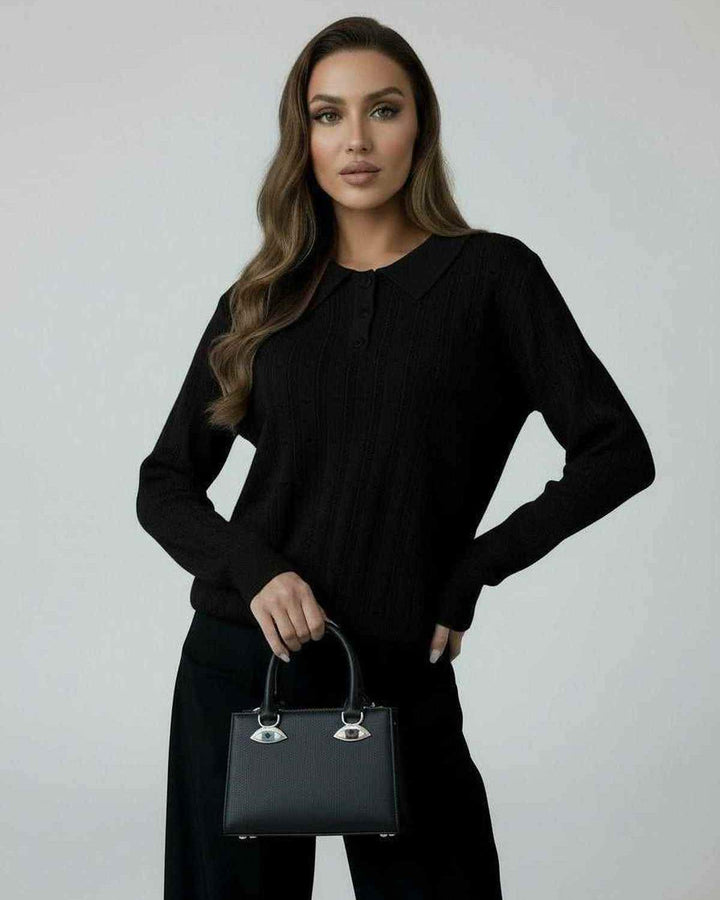 Suéter negro elegante de punto para mujer, diseño holgado y casual, perfecto para moda de invierno versátil.
