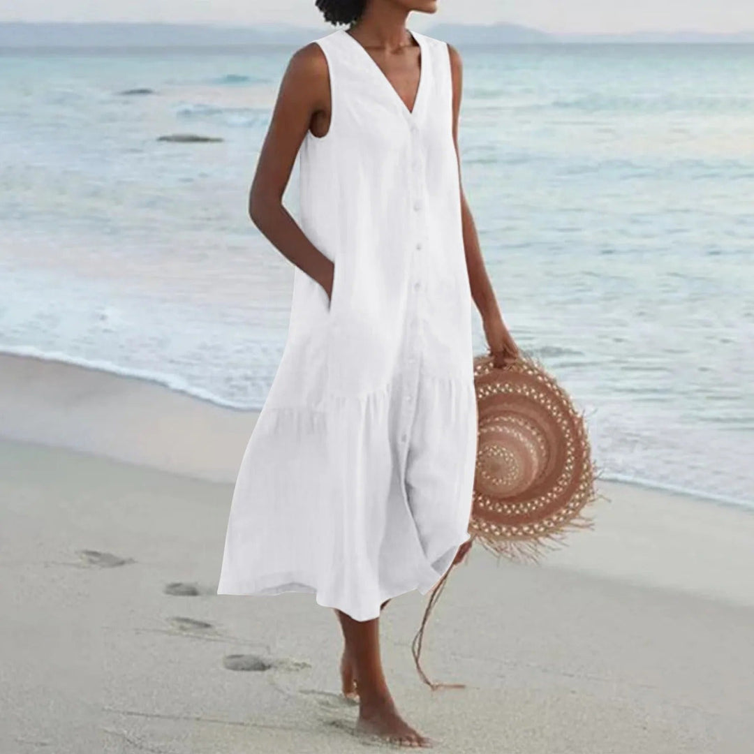 Vestido midi bohemio de mujer sin mangas, con botonadura y falda de vuelo escalonada, ideal para verano.