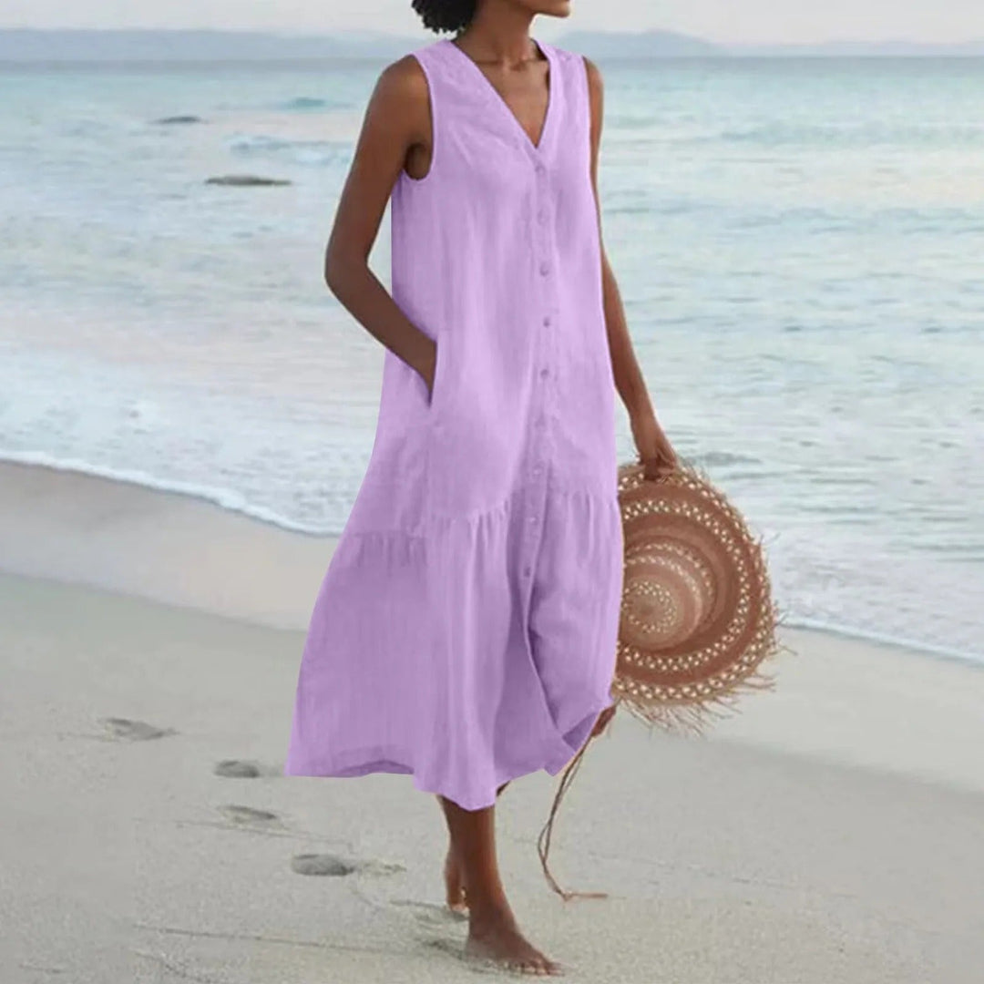 Vestido midi bohemio de mujer con diseño de capas y silueta fluida, sin mangas, para un estilo veraniego.