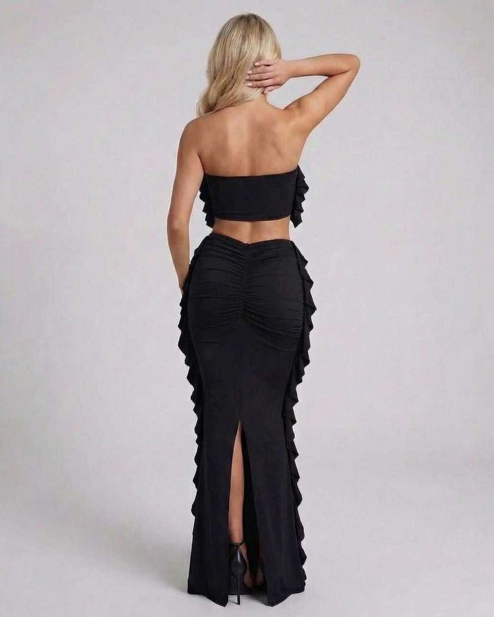 Vestido largo negro de mujer con volantes y diseño sin mangas, ideal para eventos elegantes y fiesta.
