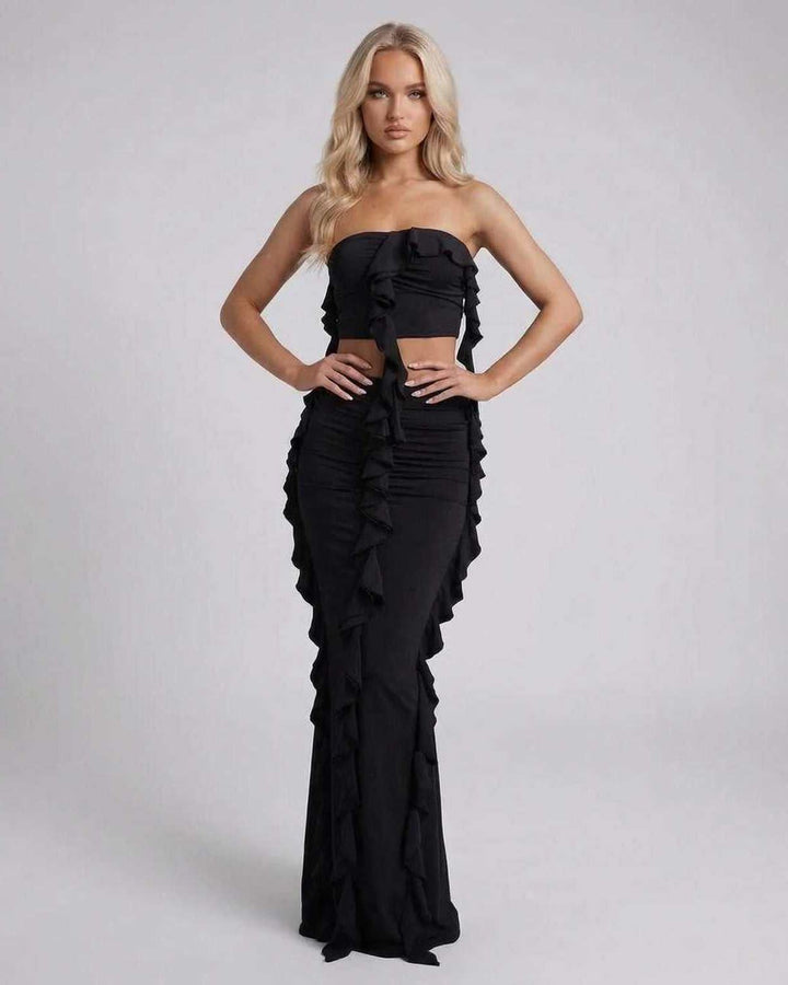 Elegante vestido maxi negro para mujer con volantes, estilo sin mangas. Ideal para fiestas y moda de noche.