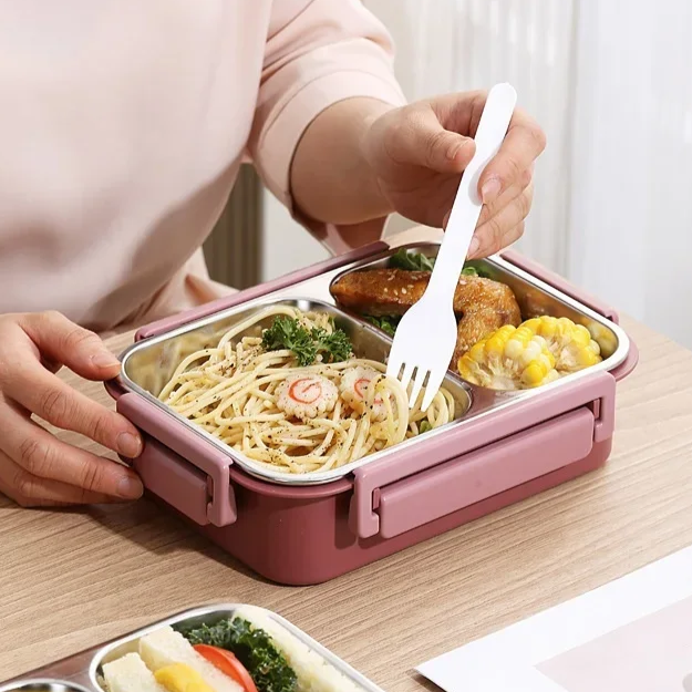 Moderna fiambrera térmica de acero inoxidable, práctica para llevar comida al trabajo o escuela.