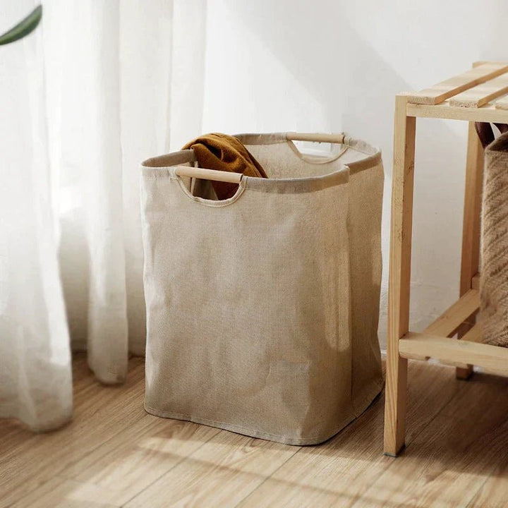 Cesto de ropa de algodón-lino plegado para fácil almacenamiento. Organizador compacto para cualquier espacio.