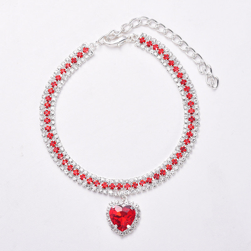 Collar de gato de lujo con cristal brillante y corazón reflectante. Ideal para estilo y seguridad de mascotas.