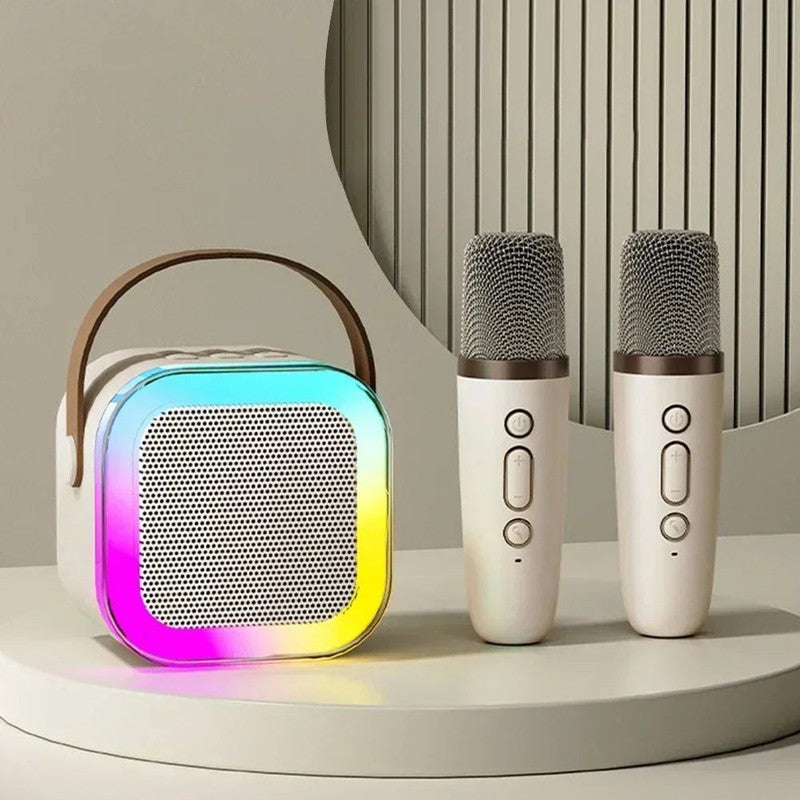 Máquina de karaoke portátil con altavoz Bluetooth y micrófonos inalámbricos para fiestas y música.