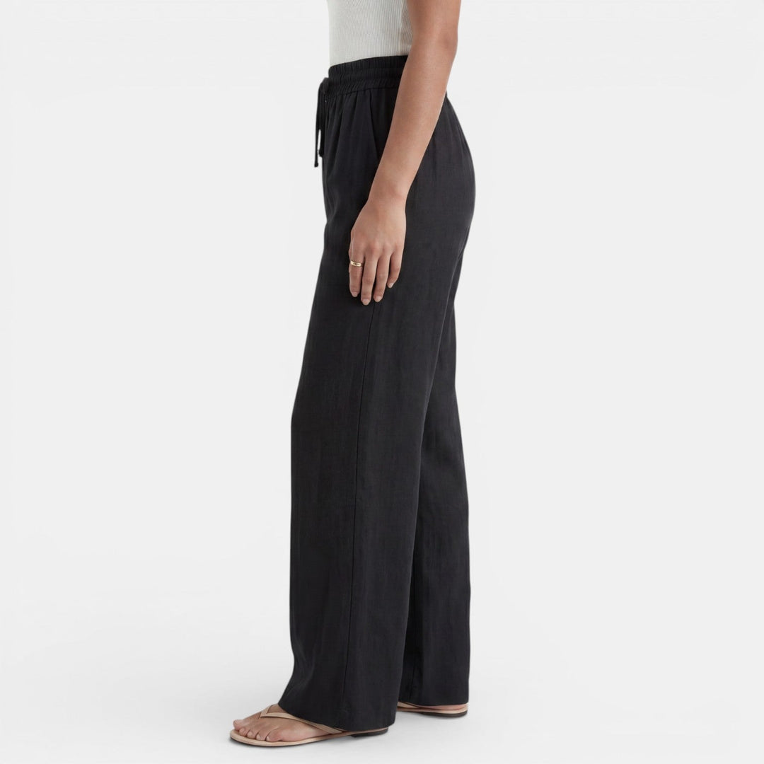 Cintura elástica del pantalón ancho de lino para mujer, ajuste cómodo y estilo holgado de verano.