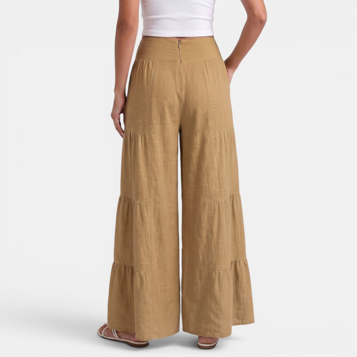 Pantalón ancho de lino blanco para mujer, diseño fresco y cómodo para días de verano.