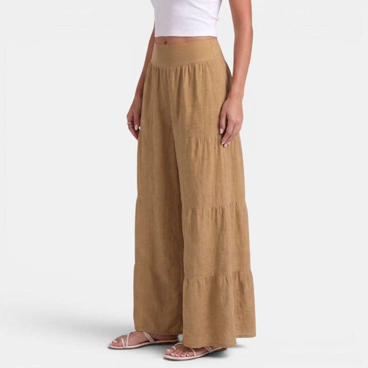 Textura del pantalón de lino ancho para mujer, detalle del tejido fresco y transpirable.