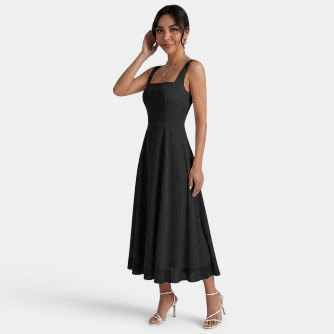 Vestido midi blanco con tirantes, moda femenina, ideal para eventos elegantes de verano.