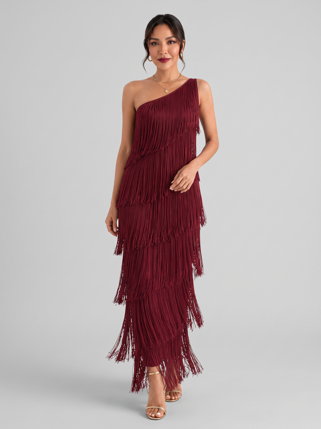 Vestido de fiesta elegante para mujer con escote V y flecos fluidos. Ideal para noches de celebración y glamour.