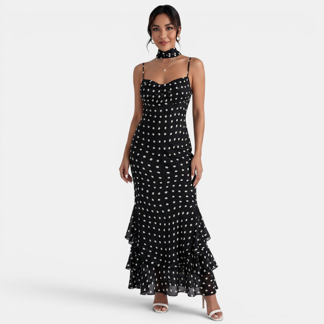 Vestido maxi halter negro de lunares blancos para mujer, estilo elegante y fluido, perfecto para fiestas de verano.
