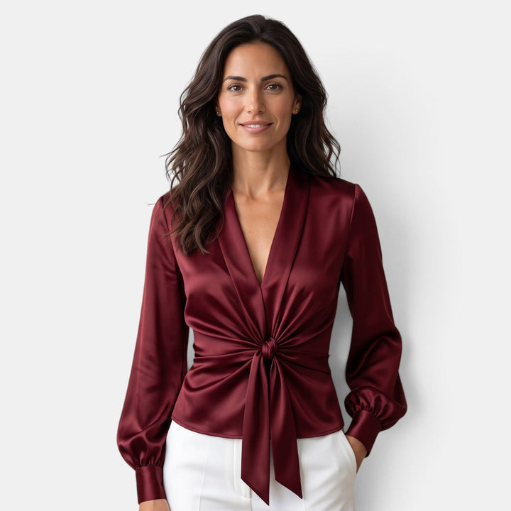 Moda femenina: blusa satinada para mujer con escote V, lazo y manga larga. Estilo elegante y moderno.